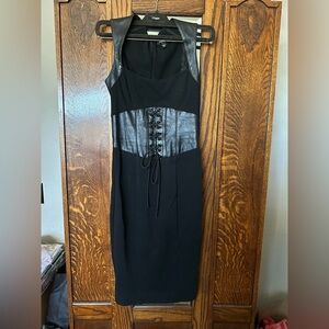 Chic and edgy black dress by Bebe